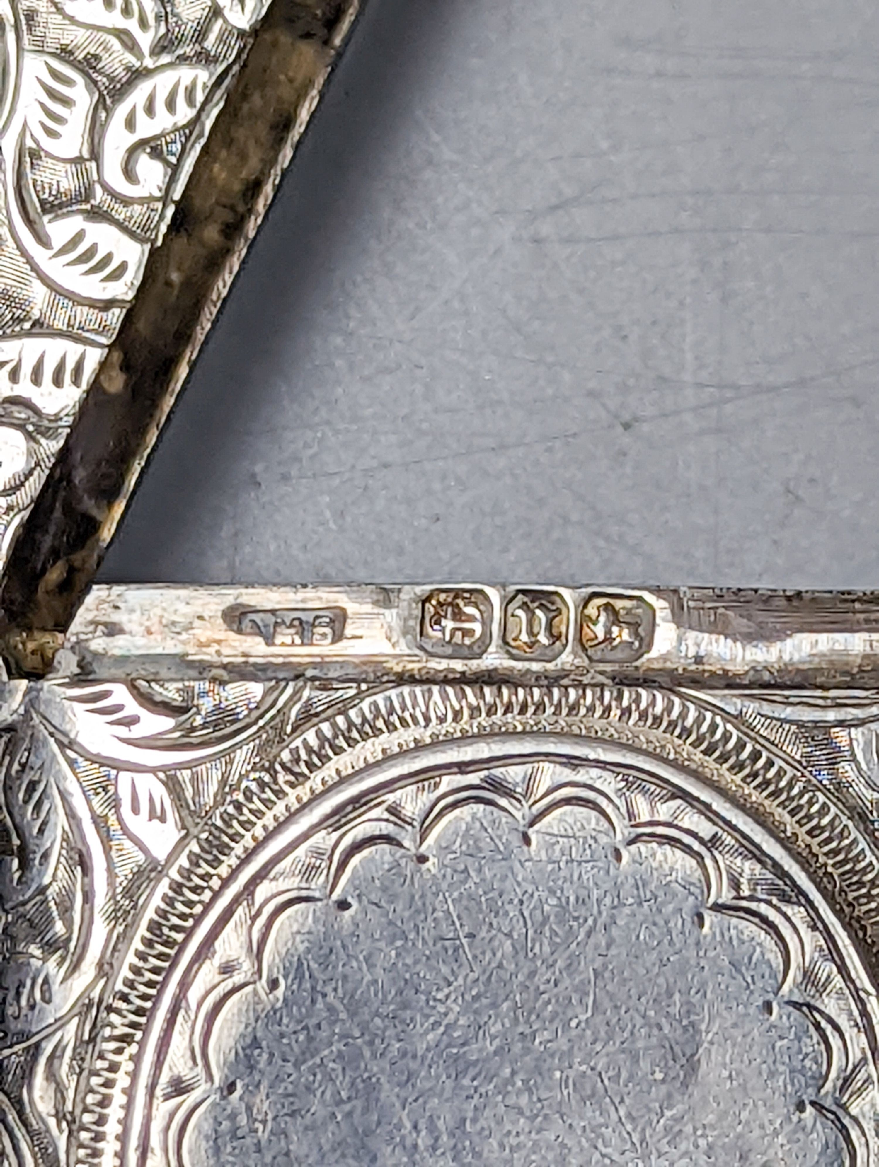 A late Victorian engraved silver vesta case with locket compartment, Abraham Meyer Blanckensee, Birmingham, 1894, 49mm.